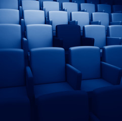 Obraz premium 3d rendering auditorium with one reserved seat toned in trendy Classic Blue color of the Year 2020