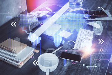 Multi exposure of table with computer and world map hologram. International data network concept.
