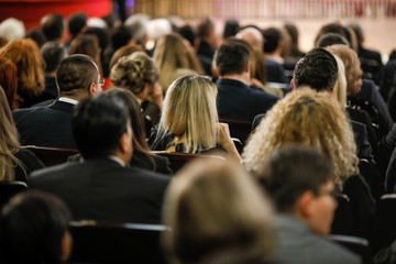 Women in the audience attending a conference - women targeted events.