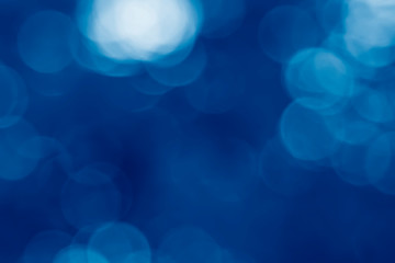 image of summer blur background toned in trendy Classic Blue color of the Year 2020