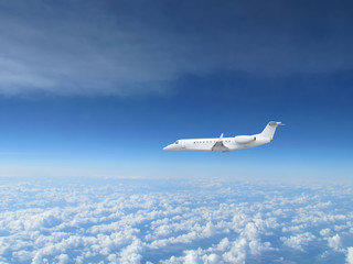 Naklejka na ściany i meble White private jet business jet flies against backdrop of beautiful white clouds on blue sky