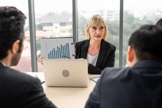 Businesswoman Presentation report financial growth chart in meeting room at office