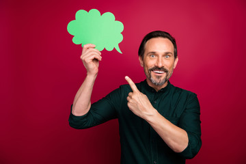 Photo of cheerful excited man looking pointing empty space of bubble demonstrating his idea to you with shocked emotions on face isolated vivid color background