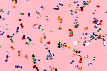 Colour sparkles on pink holiday background. Festive backdrop for your projects. - Image