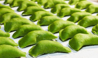 Homemade spinach dumplings. Handmade/focus on the middle