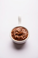 Homemade Tandoori Paste or Marinade mixture, in a bowl. used for grilled chicken or Paneer or vegetable. selective focus