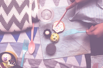 kids play make believe tea party with children's toys and tea set in bedroom