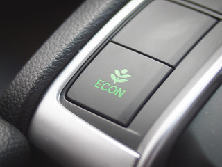 Eco mode button in car interior Is an energy-saving driving mode