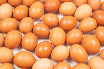 Group of raw brown eggs.
