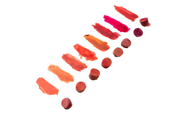 Lipstick swatches isolated on white background.