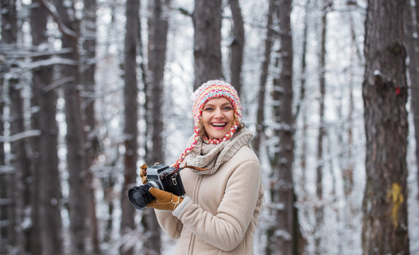 Happy tourist woman in winter. professional photographer outdoor in winter. woman use vintage camera. hobby time outdoor in winter day. admiring winter mountain landscape
