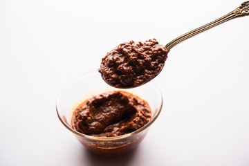 Homemade Tandoori Paste or Marinade mixture, in a bowl. used for grilled chicken or Paneer or...