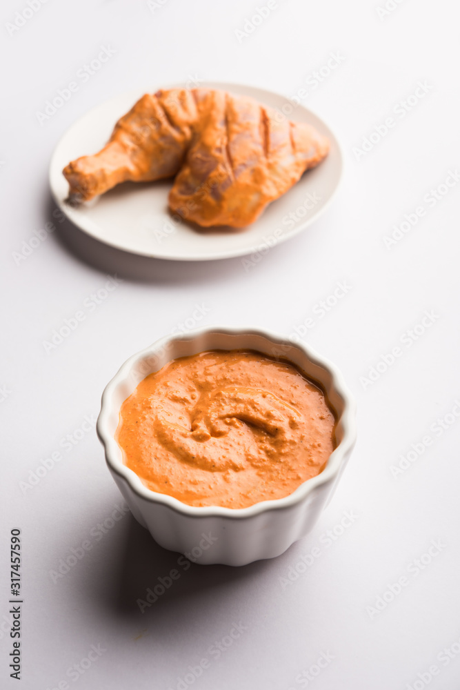 Wall mural Homemade Tandoori Paste or Marinade mixture, in a bowl. used for grilled chicken or Paneer or vegetable. selective focus