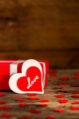 Valentine's day greeting card for love with red and white heart shape and gift box on wooden background - 317457521