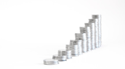 A stack of coins in ascending order. Profit growth concept. The economic growth. On white...