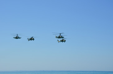 Russian military helicopters flying over the sea