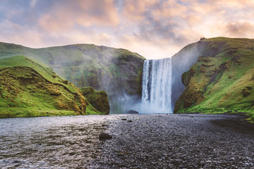 Famous Skogafoss waterfall on Skoga river in sunrise time. Iceland, Europe. Landscape photography