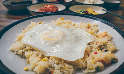 close up view of fried rice with vegetables and pawns