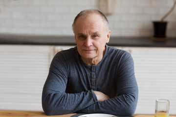 portrait of happy senior man looking at camera