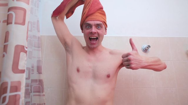 Joyful man in the bathroom shows like