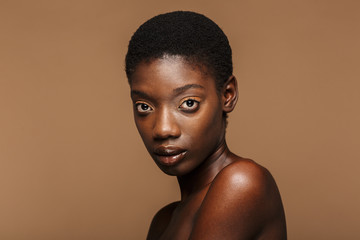 Beauty portrait of young half-naked african woman with short black hair