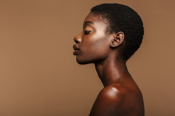 Beauty portrait of young half-naked african woman with short black hair