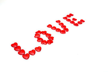 Word love with colored beads on white background
