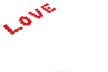 Word love with colored beads on white background