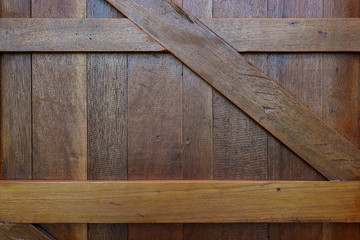 closed timber wood door of warehouse industry, design of rustic wooden barn wall background