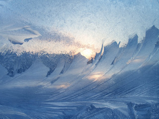 Beautiful ice pattern and sunlight on glass