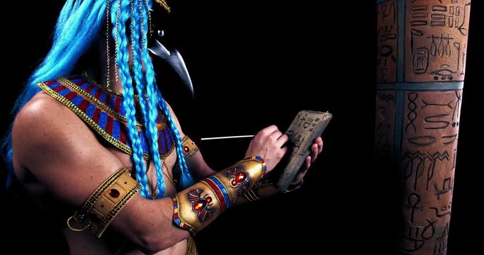 Ancient egyptian god Thoth is writing on a stone, deity of wisdom, 4k