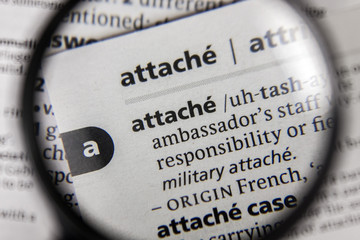 The word or phrase attache in a dictionary.