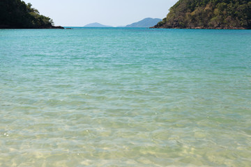 Blue sea waves summer background. Sand beach