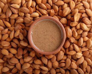 Apricot kernel butter smooth, urbech. Natural paste from apricot kernels. Top view. Food background.