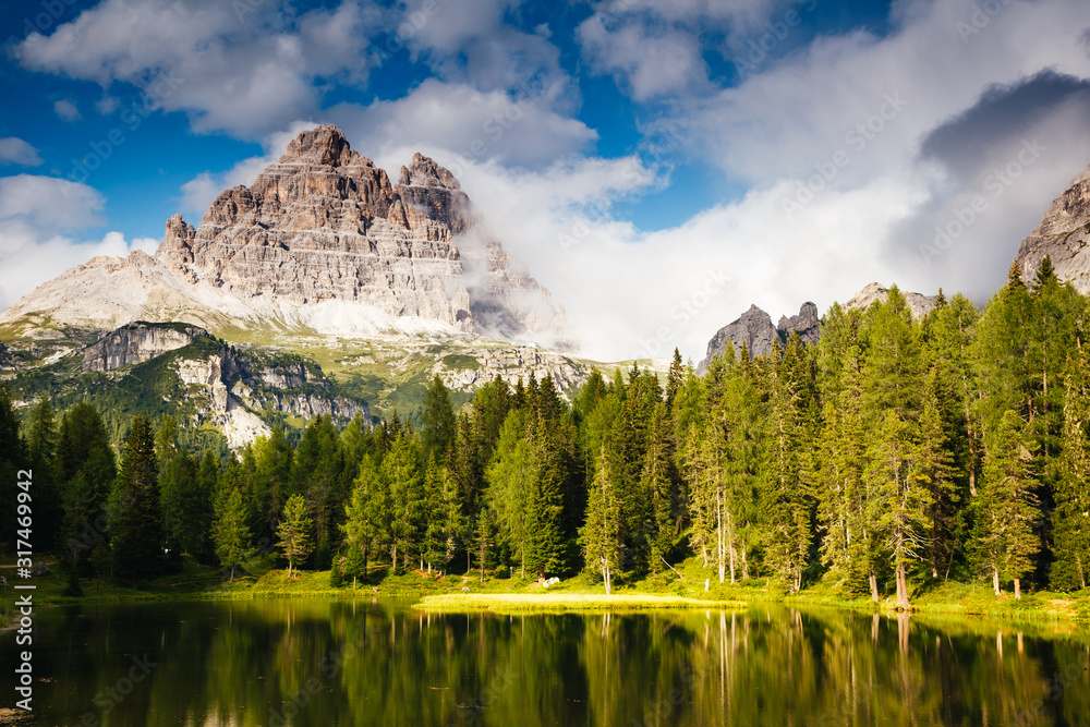 Wall mural Stunning image of the Antorno lake in National Park Tre Cime di Lavaredo.