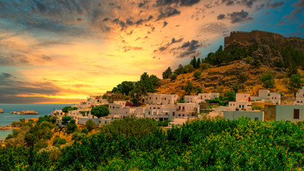 The historic city of Lindos and the Acropolis of Lindos on Rhodes at sunset, Greece