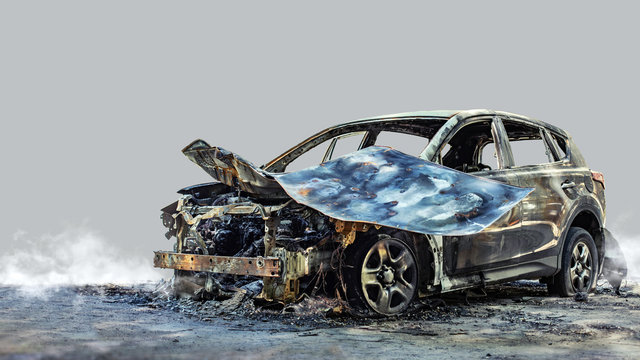 Burnt new car. Isolated on grey background.
