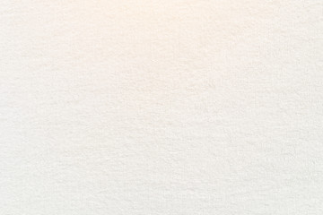 White towel texture for background. Flat and smooth with fabric or textile consist of cotton fiber material. Look plush, fluffy, dry, soft and clean. For background of baby, spa, hotel and laundry.