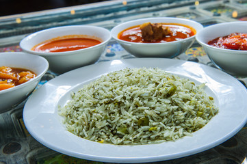 Chilli dip spicy on rice with different toppings.