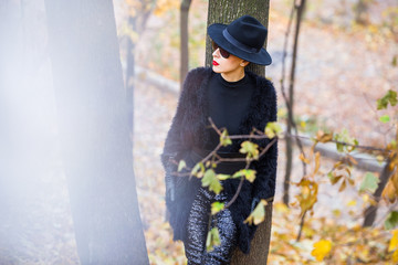 stylish woman in autumn park