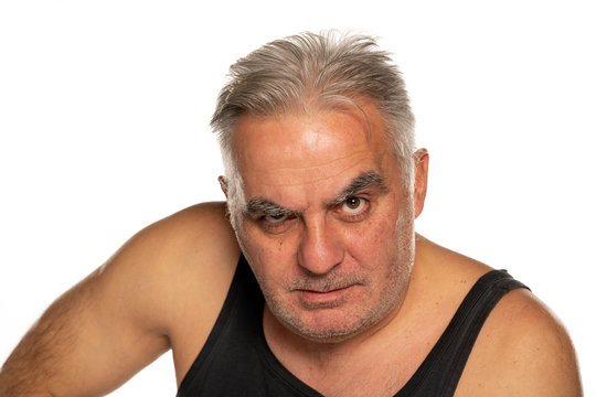 middle aged angry man with short gray hair on white background