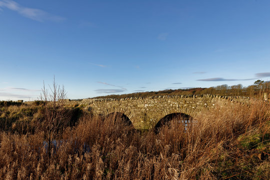 The double arched stone footbridge along which the Coastal foot and cycle path runs between Johnshaven and Inverbervie in Aberdeenshire.