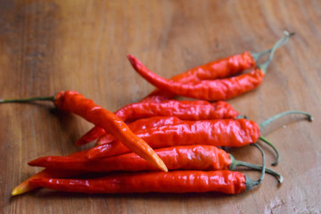 red chili peppers on wooden table
