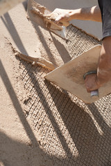 Man plastering wall