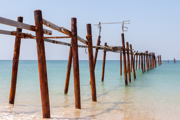 Beautiful old wooden bridge in the sea at  Khao Pilai Beach Thailand.