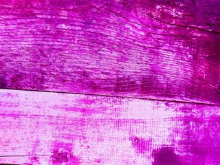 Obraz premium Purple pink rustic wooden wall texture background. Close-up wall wooden rustic plank panel or board as purple texture background. Old grunge purple wooden rustic wall. Vintage paint wood plank texture