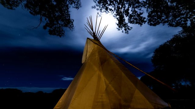 timelapse Moonlight shines on Indian Tepee at Ute Indian Museum, Montrose, Colorado