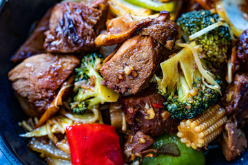 Duck Breast Fillets Steak with Orange Halves and Vegetables. Close up Macro View.