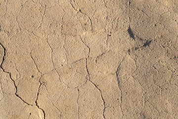 Concrete coating. Cracked stone background. Cement slab. Wall of the house.