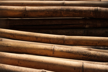 Bamboo poles closeup used for scaffolding on building  site